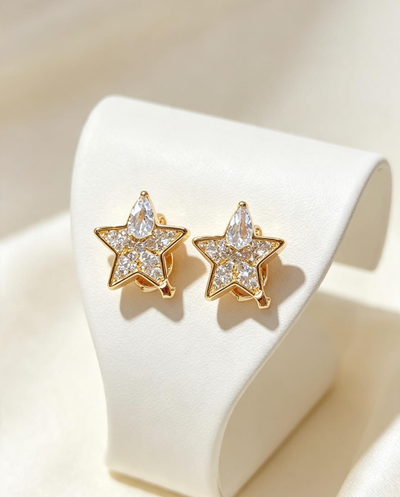 Aretes estrella con piedras en oro laminado - Variante 3K1YN
